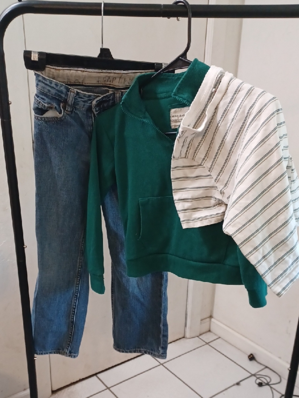 Green Pullover Hoodie with Striped Shirt Accent And GAP jeans